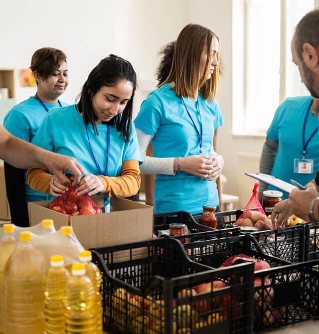 Volunteers Packing Food Donations